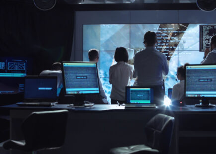 People working in mission control center